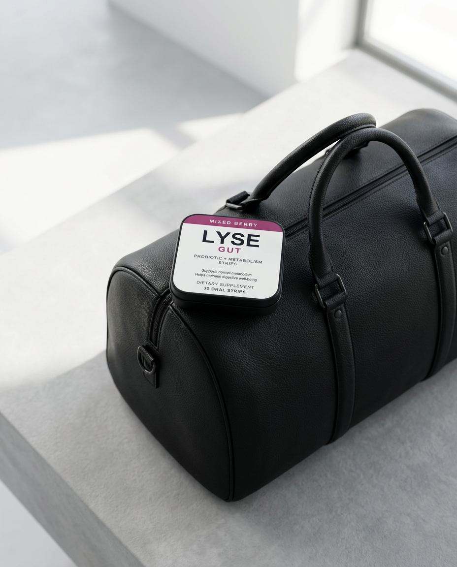 LYSE Gut dissolving oral strips packed for travel on a black weekender bag